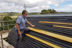 Sean-Flynn-on-roof-scaled