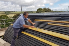 Sean-on-roof-2-scaled